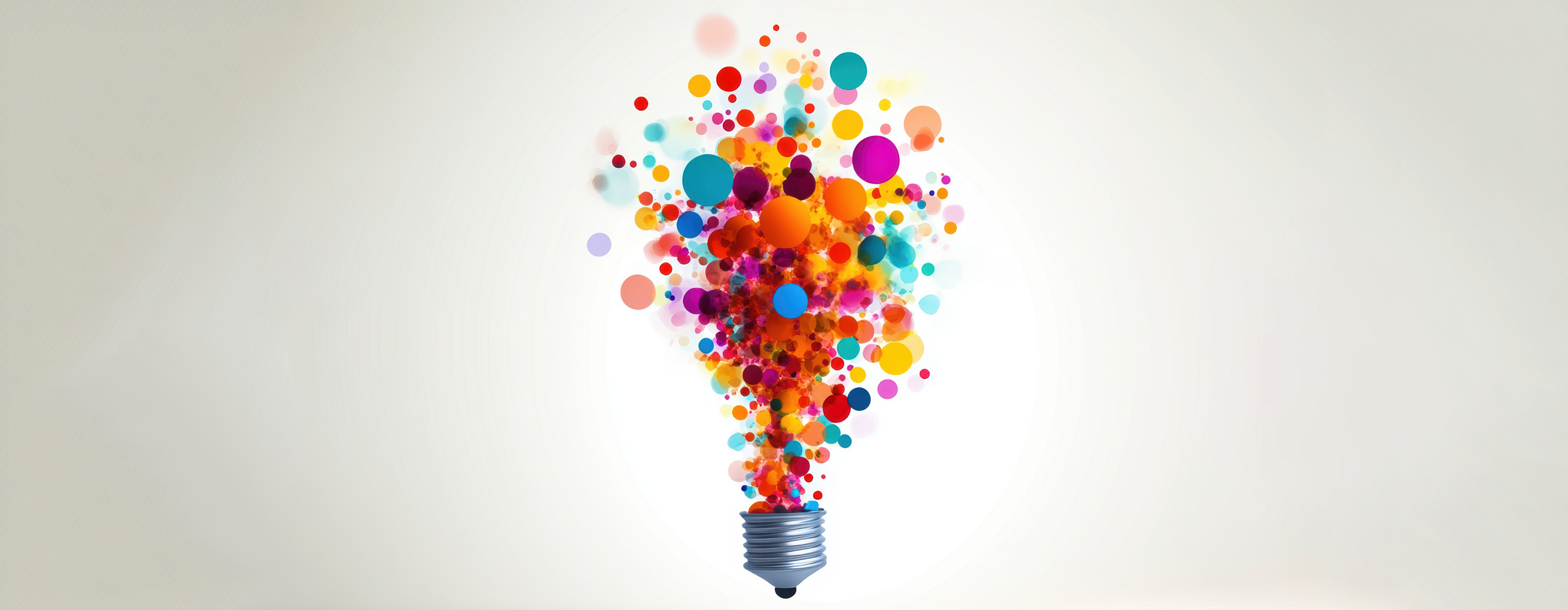 Lightbulb made from multiple colored dots on a white background