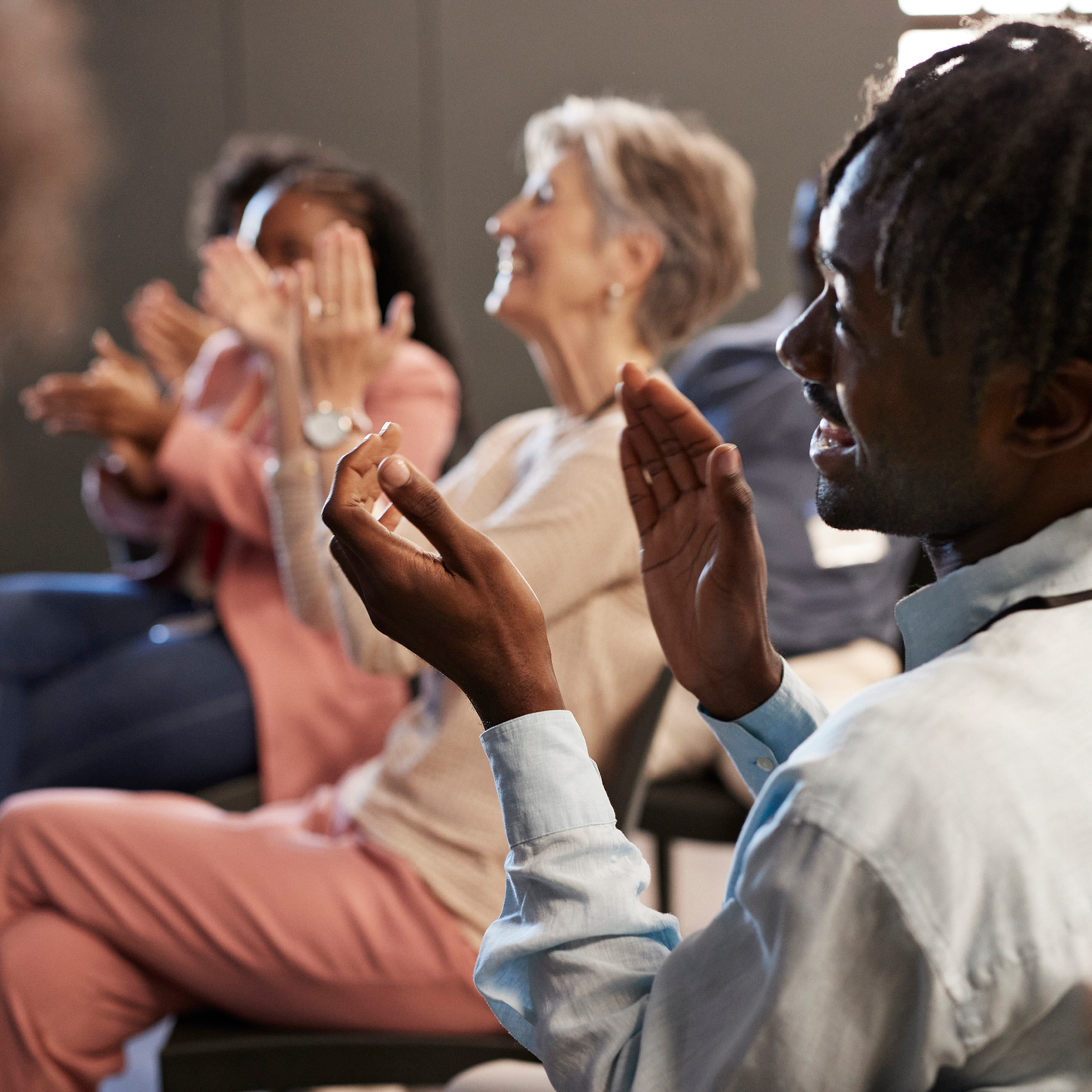 Man clapping in the audience