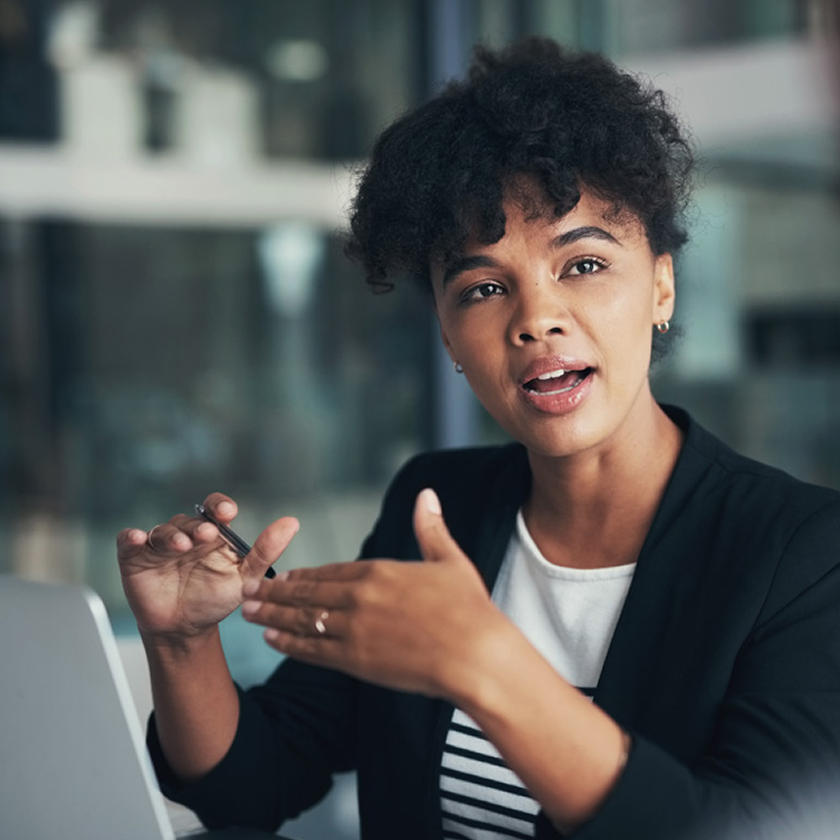 A woman is talking to a friend and using her hands