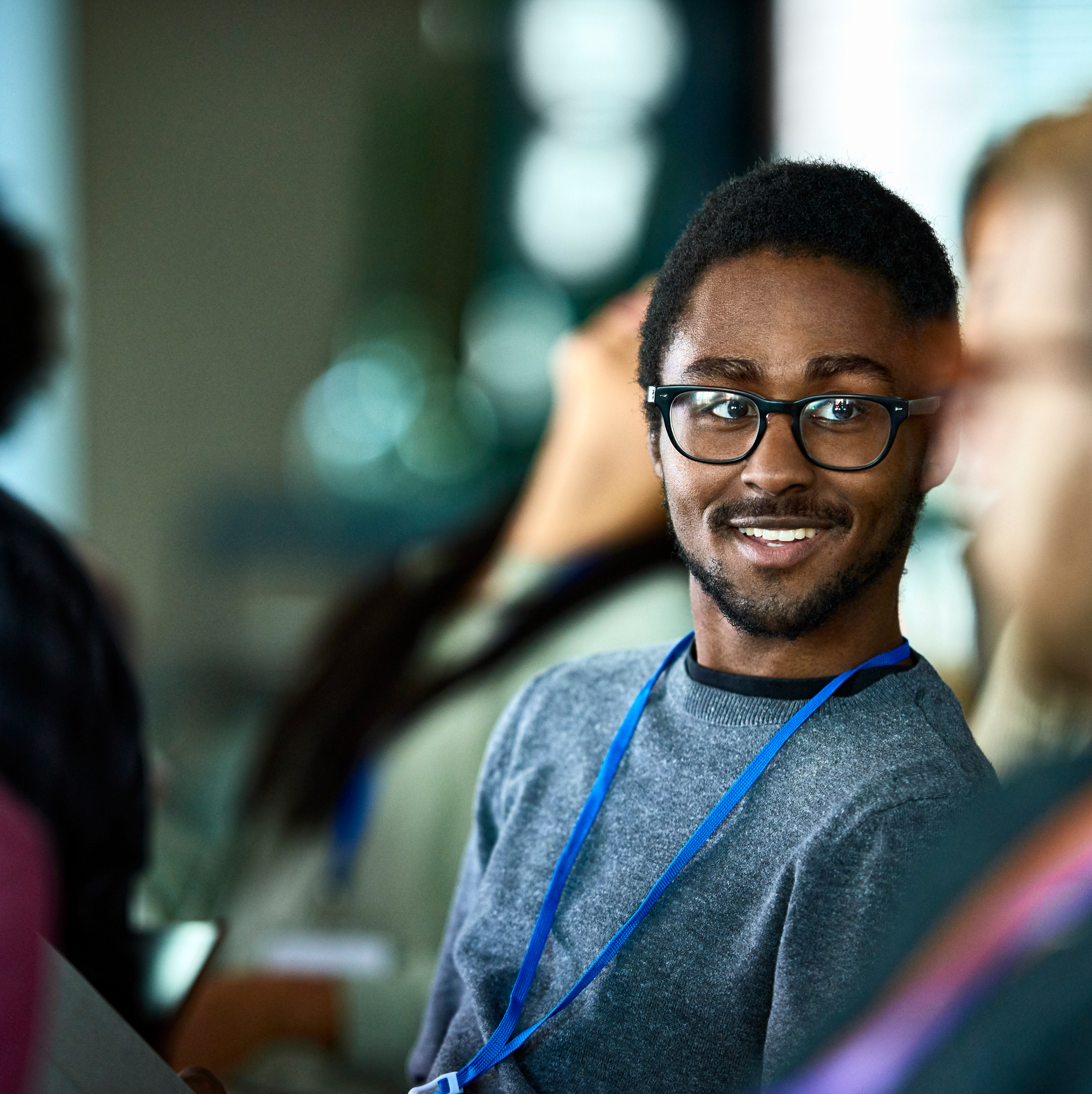 A young man is talking to a friend