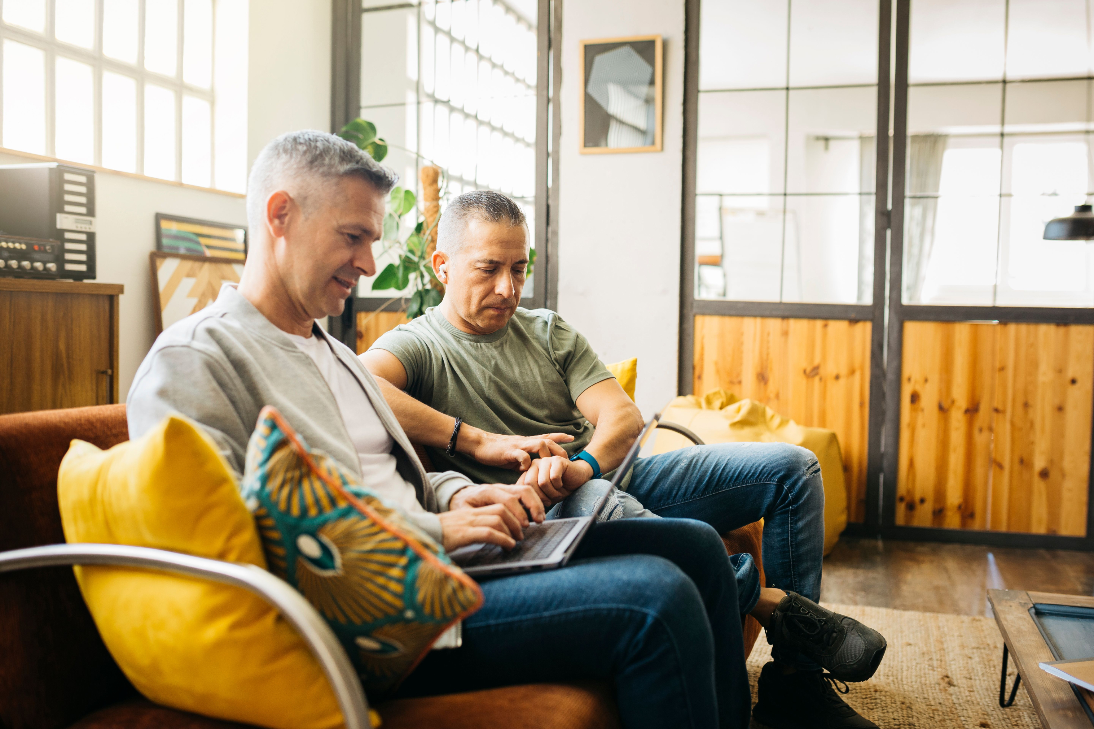 Click image of two people sitting together looking at document to navigate to article: How to invest as you near retirement