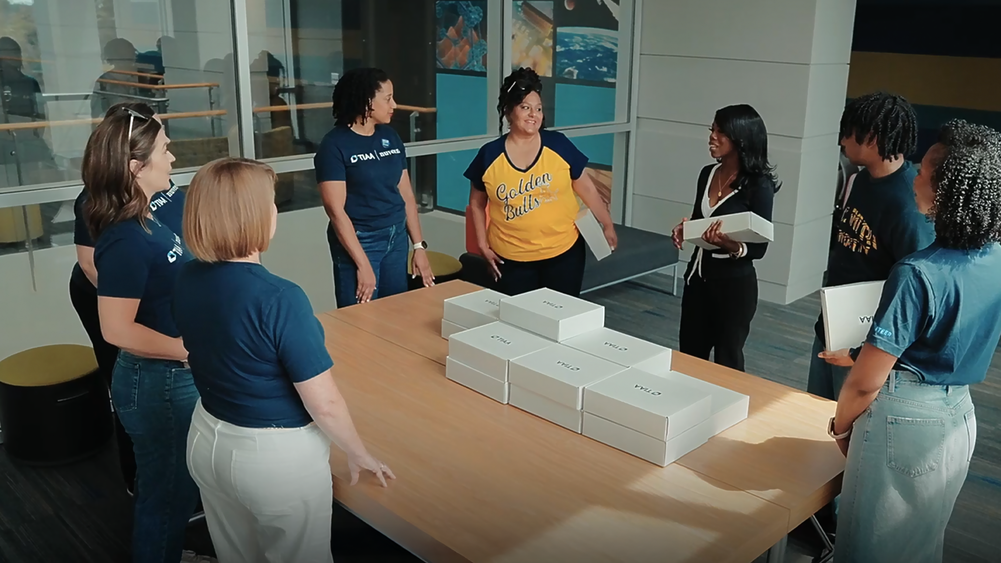 A video thumbnail where community people are distributing TIAA packages