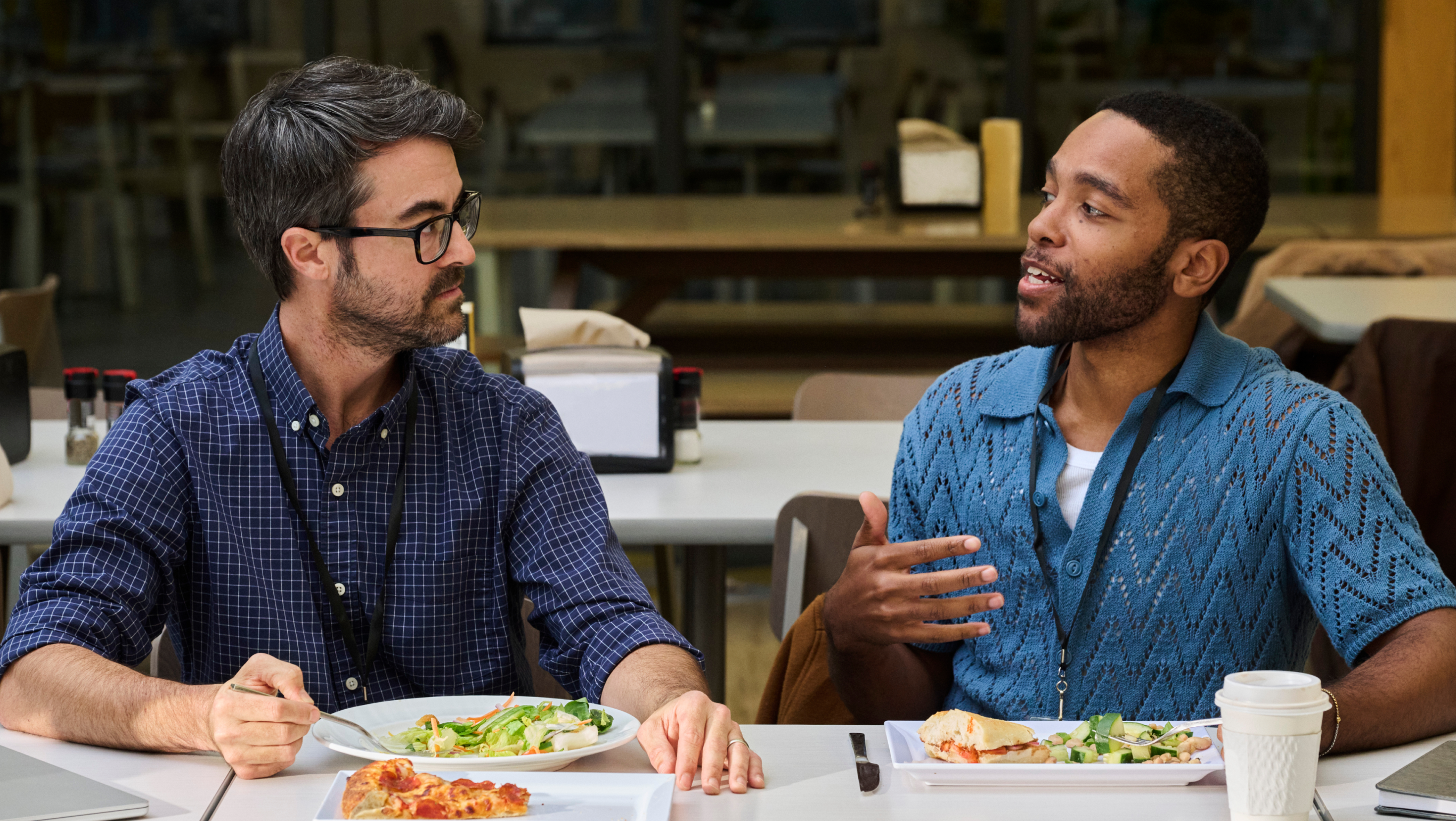 Two people discussion while having food
