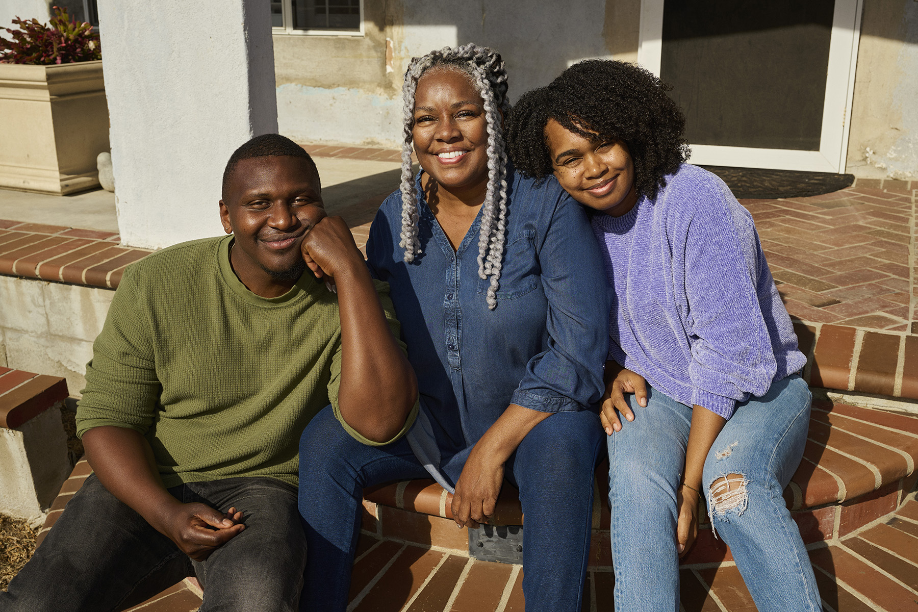 a group of people sitting on a step