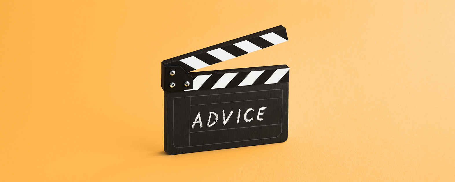 Illustration of movie clapboard with the word advice written in chalk. 