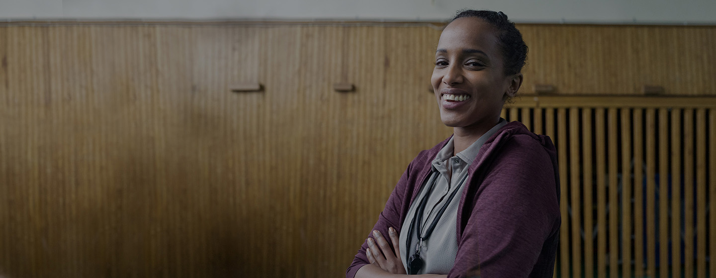 Woman smiling with arms crossed