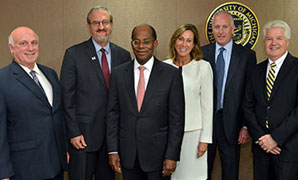 Roger Ferguson (center) was joined by Doug DiCocco, University of Michigan President Mark Schlissel, Maria Schneider, University of Michigan CFO Kevin Hegarty and Dan Conmy during a visit to the university campus in Ann Arbor, Michigan.