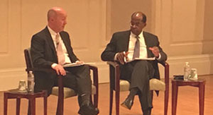 Professor Frank Warnock conducts a Q&A with Roger Ferguson during the University of Virginia Investing Conference.